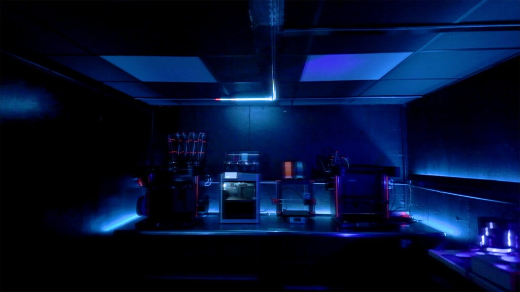 A pair of Arduino UNO R4 boards power this Tron-inspired, decked-out shop room