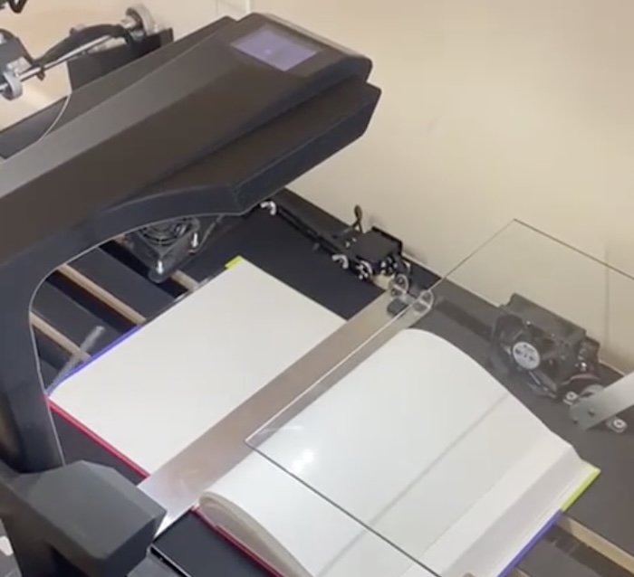 This machine automatically scans books from cover to cover
