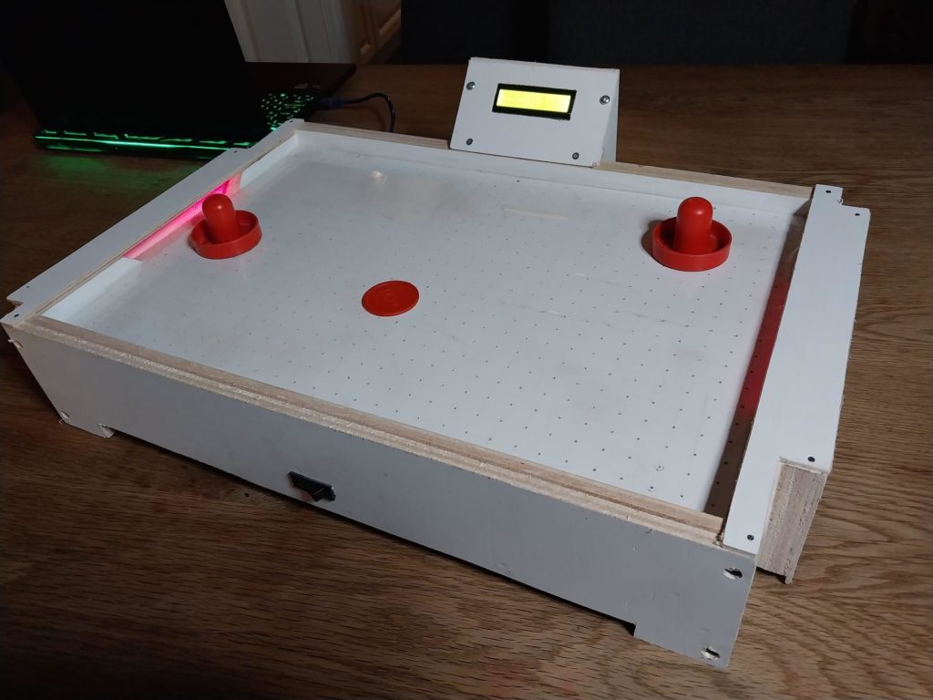 This small scorekeeping air hockey game brings the arcade classic to your tabletop